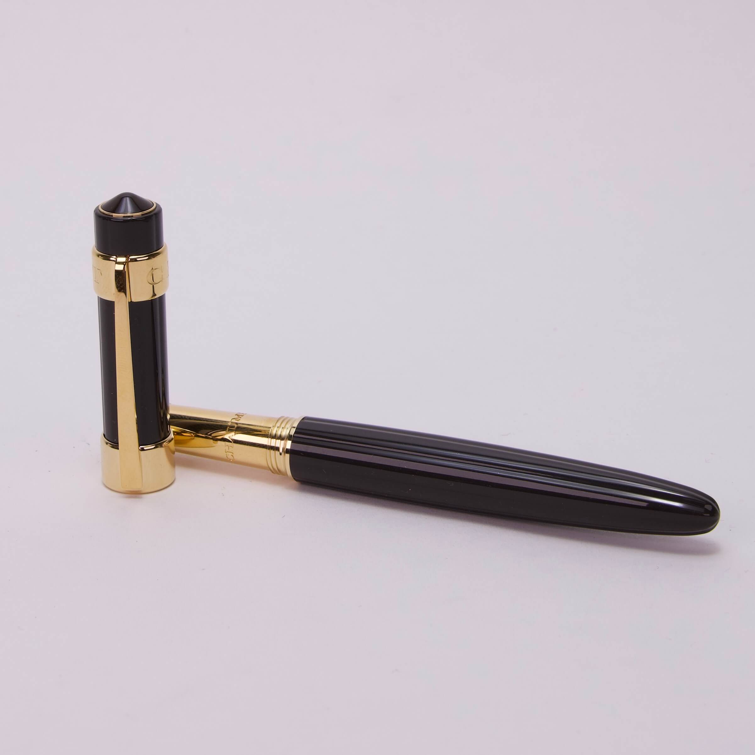 Black and gold pen on display.
