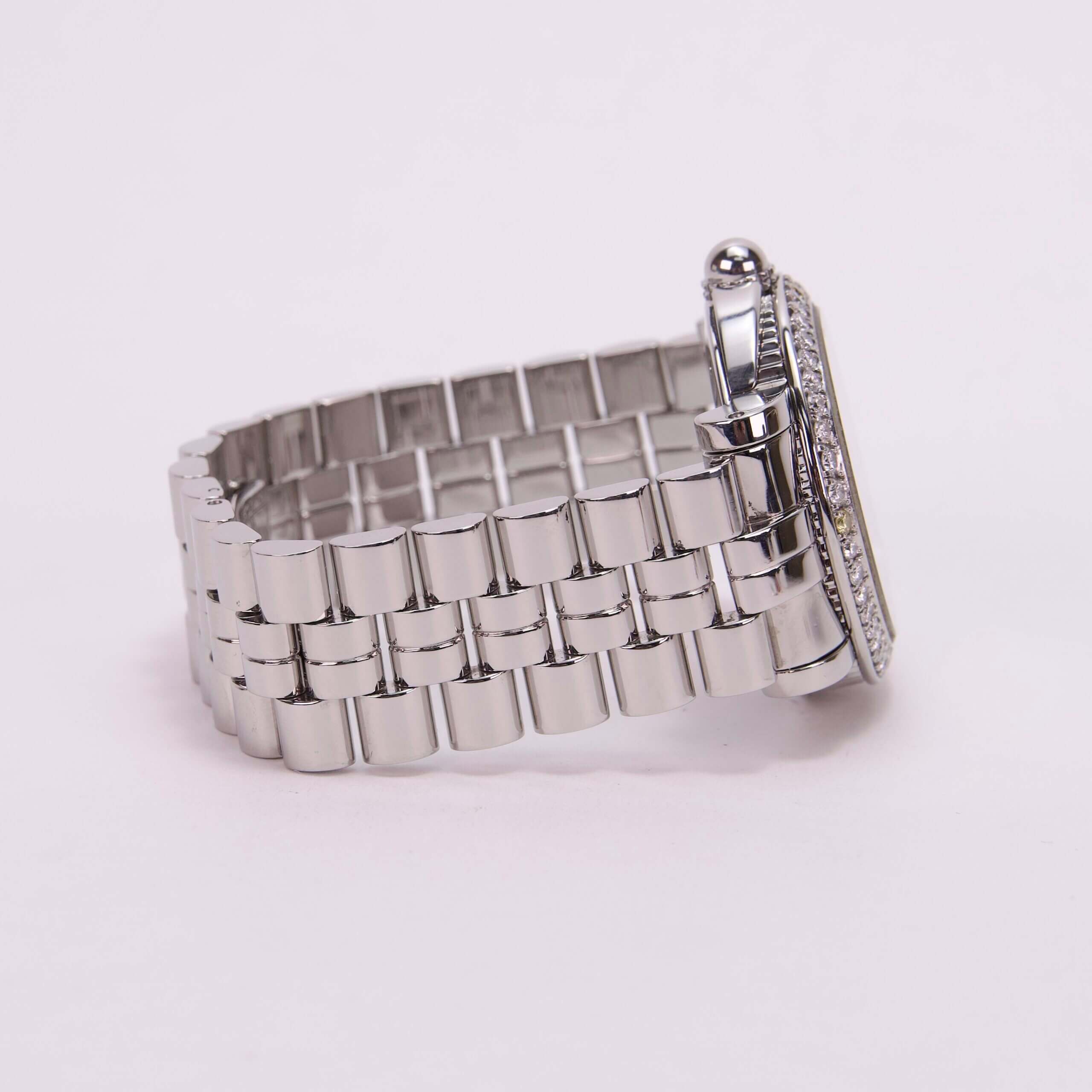 Silver watch with metal link band.