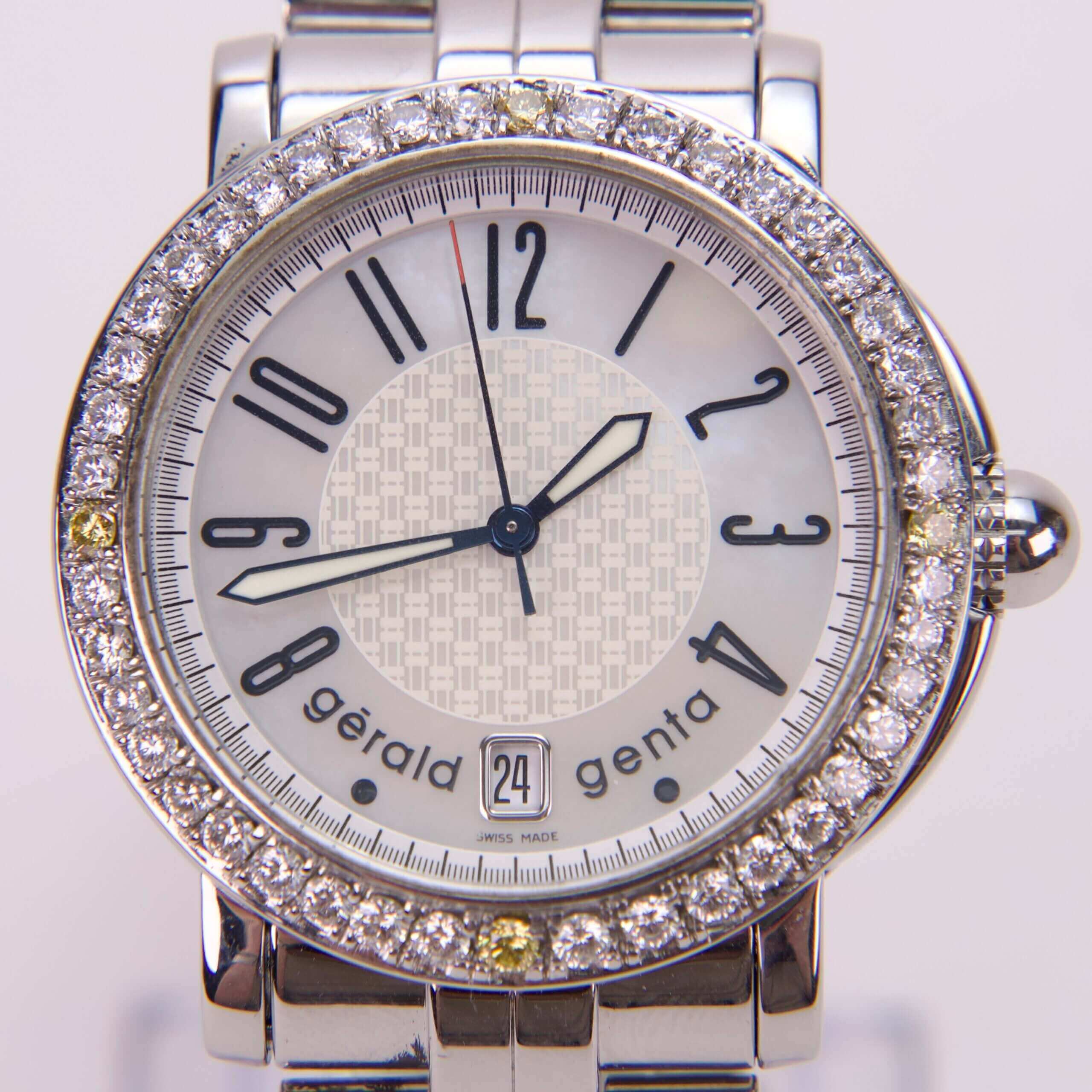 Luxury diamond-embellished watch with silver bracelet.