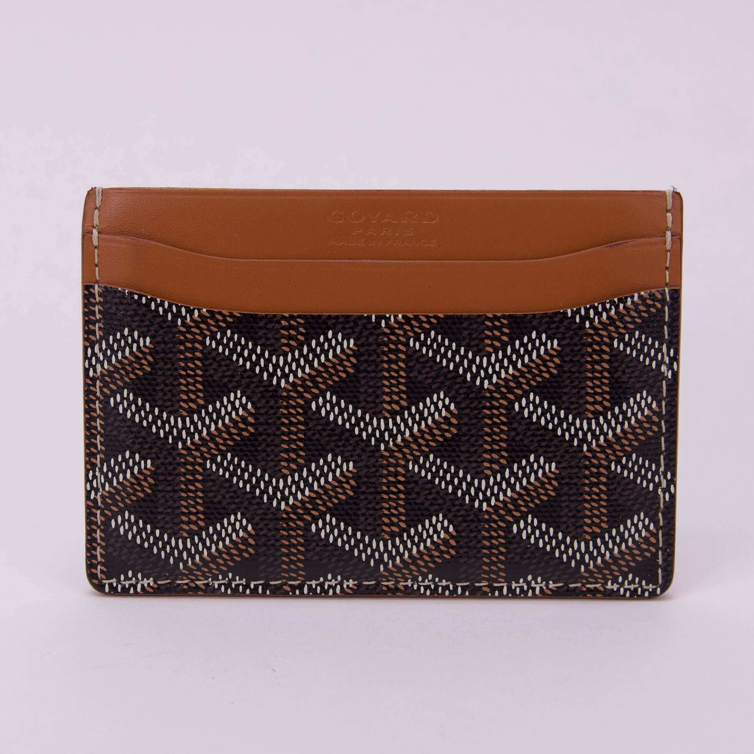 Brown and black patterned leather card holder.