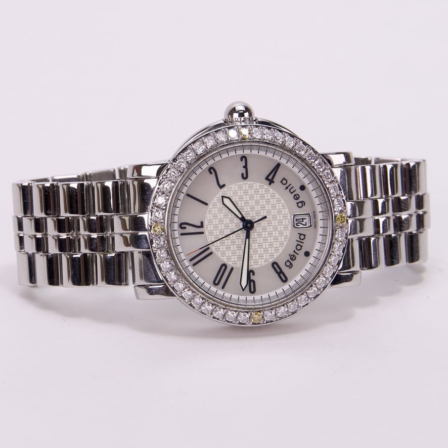 Silver wristwatch with diamond-studded bezel.