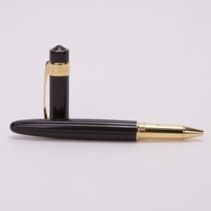 Black and gold ballpoint pen on display.