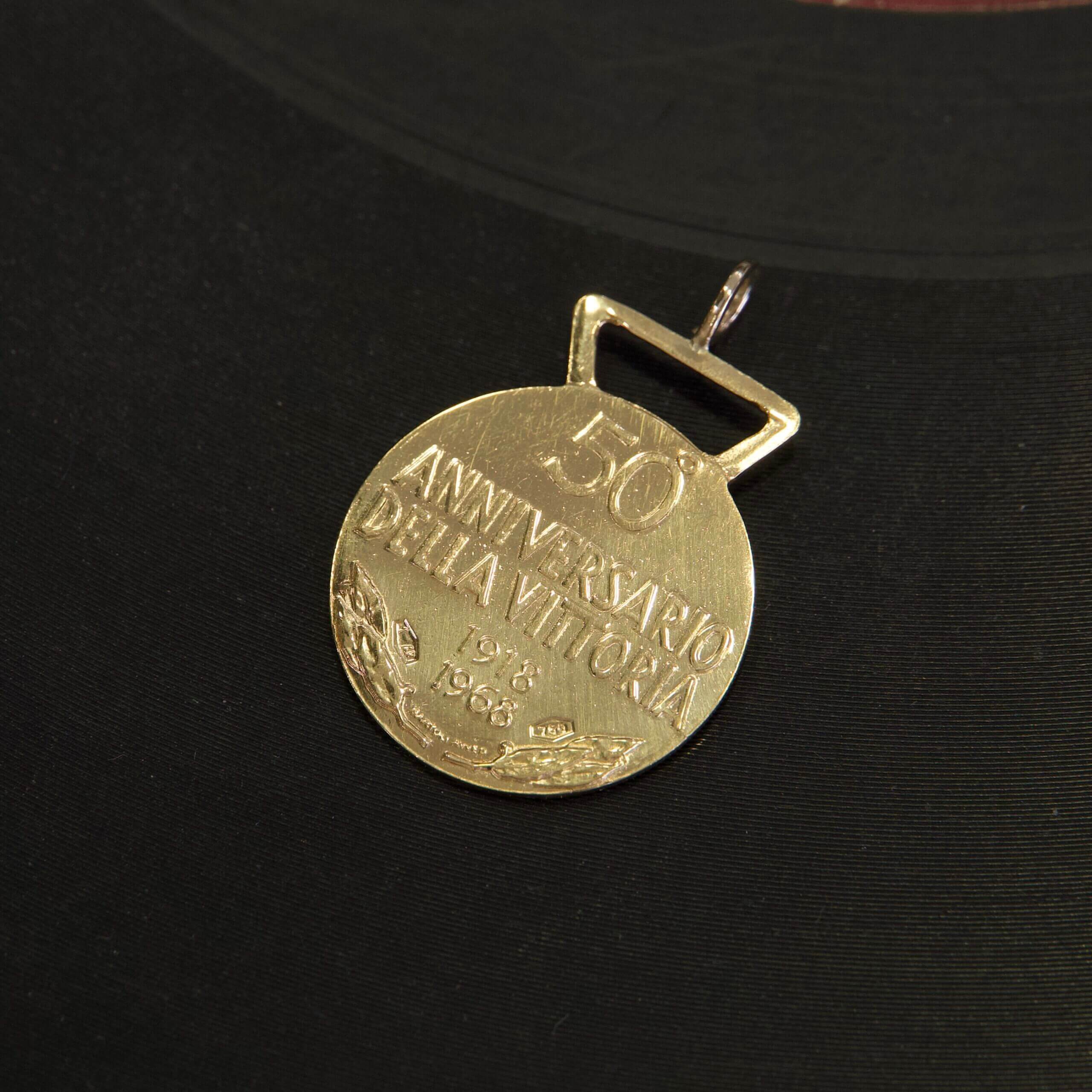 Gold medal commemorating 50th anniversary.