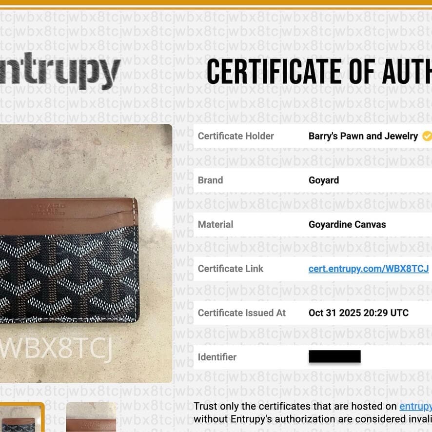 Goyard wallet with authenticity certificate displayed.