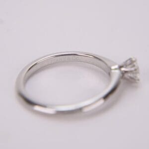 Silver engagement ring with diamond solitaire.
