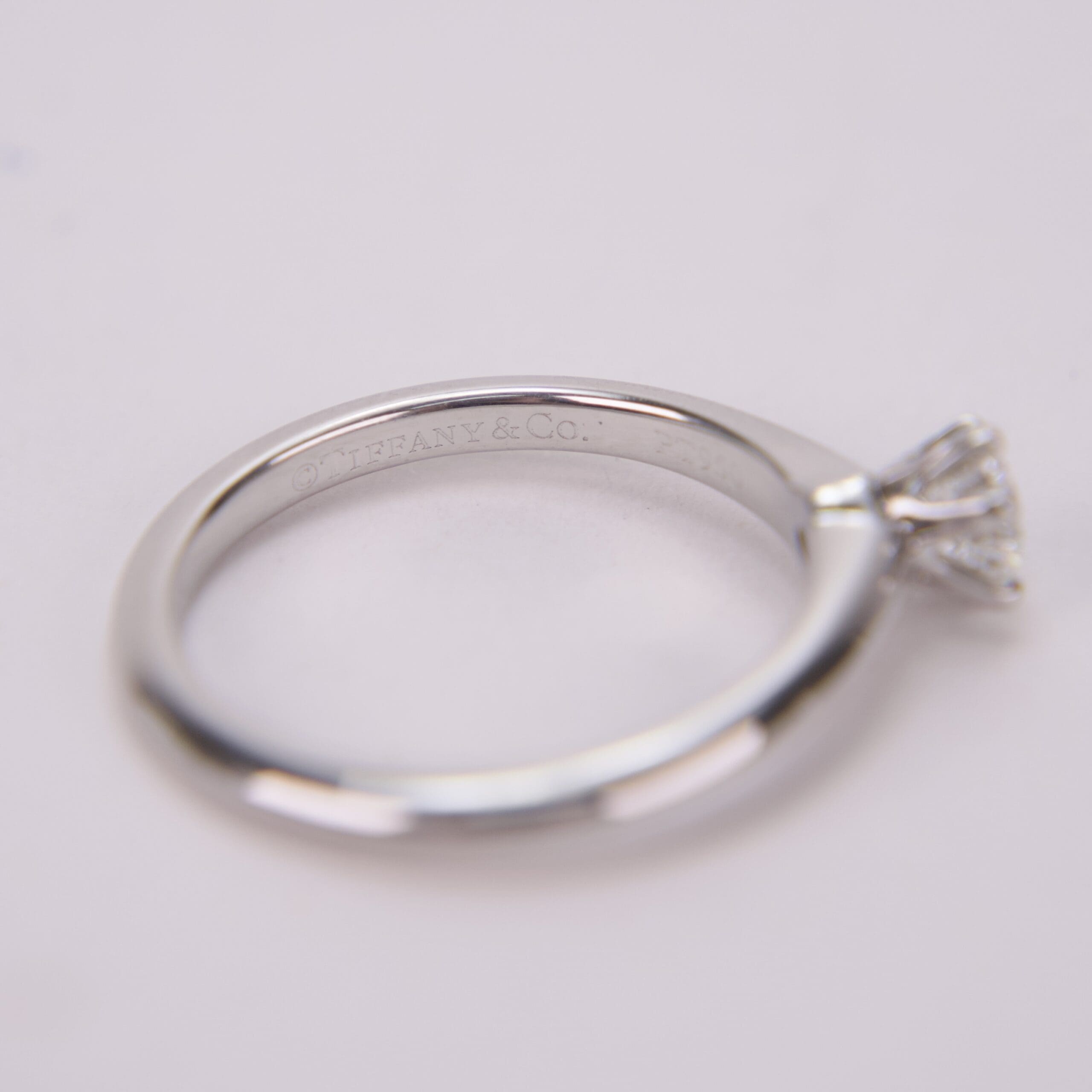 Silver engagement ring with diamond solitaire.