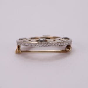 Gold and silver brooch with diamonds.