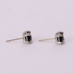 Silver earrings with black stones.