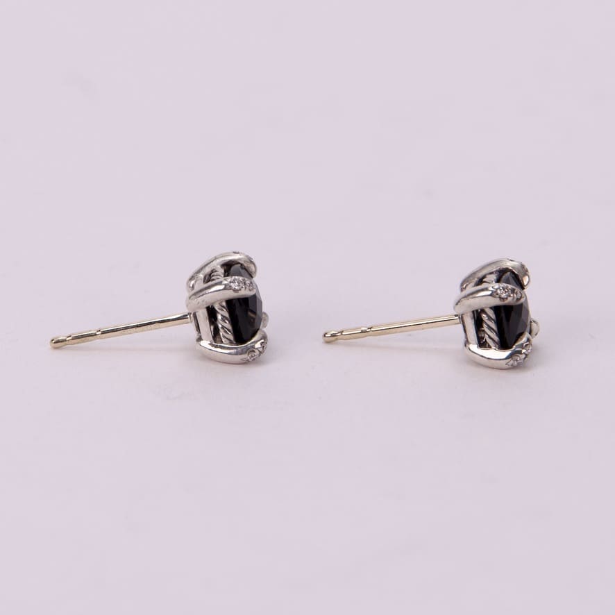 Silver earrings with black stones.