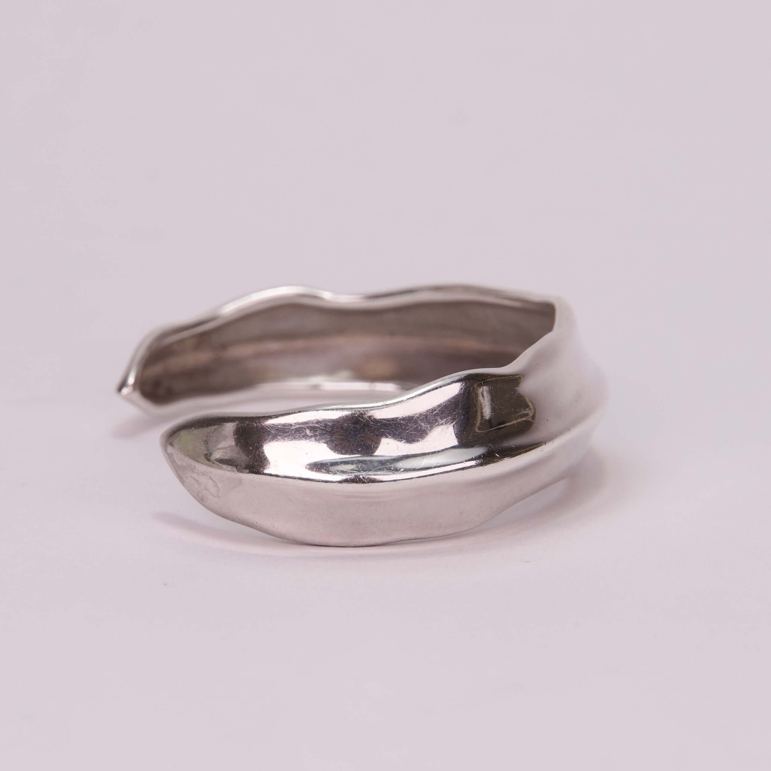 Silver cuff bracelet with organic design.