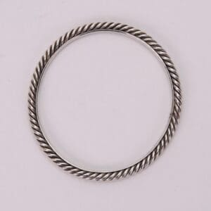 Silver twisted rope design bangle bracelet.
