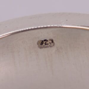 Silver jewelry stamp reading ".925" close-up.