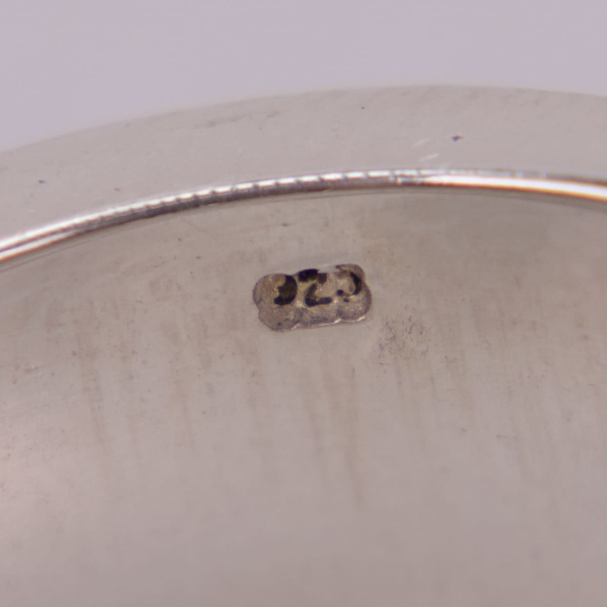 Silver jewelry stamp reading ".925" close-up.