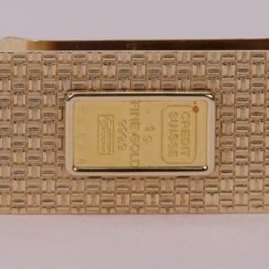 Gold bar with detailed textured surface.