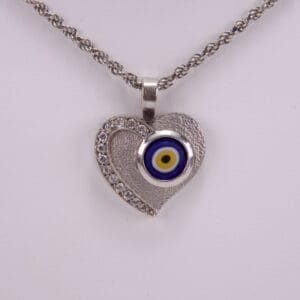 Heart necklace with evil eye pendant.