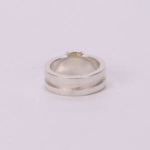 Silver ring with a textured band.