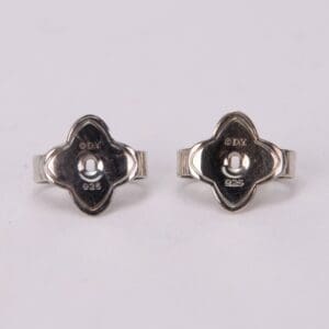 Silver earrings with unique floral design.