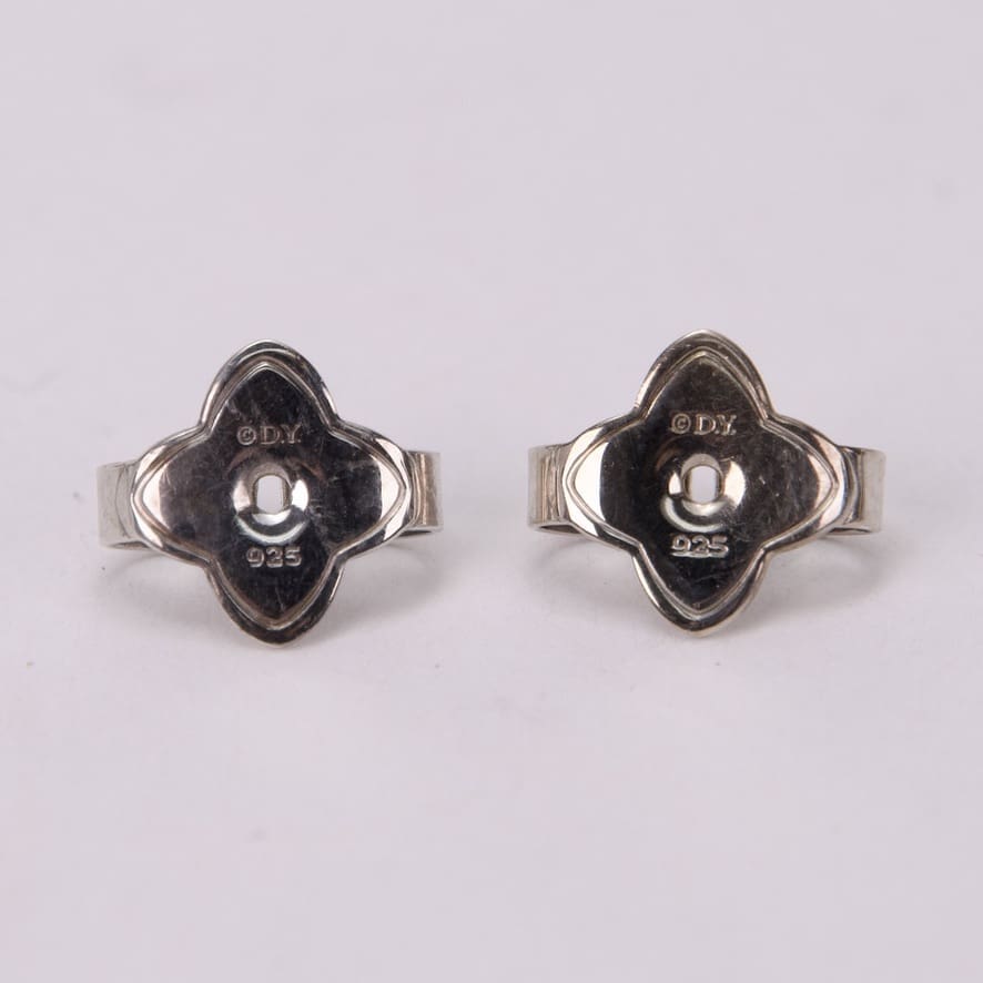 Silver earrings with unique floral design.