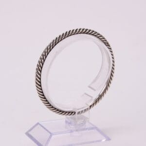 Silver twisted rope design bracelet display.