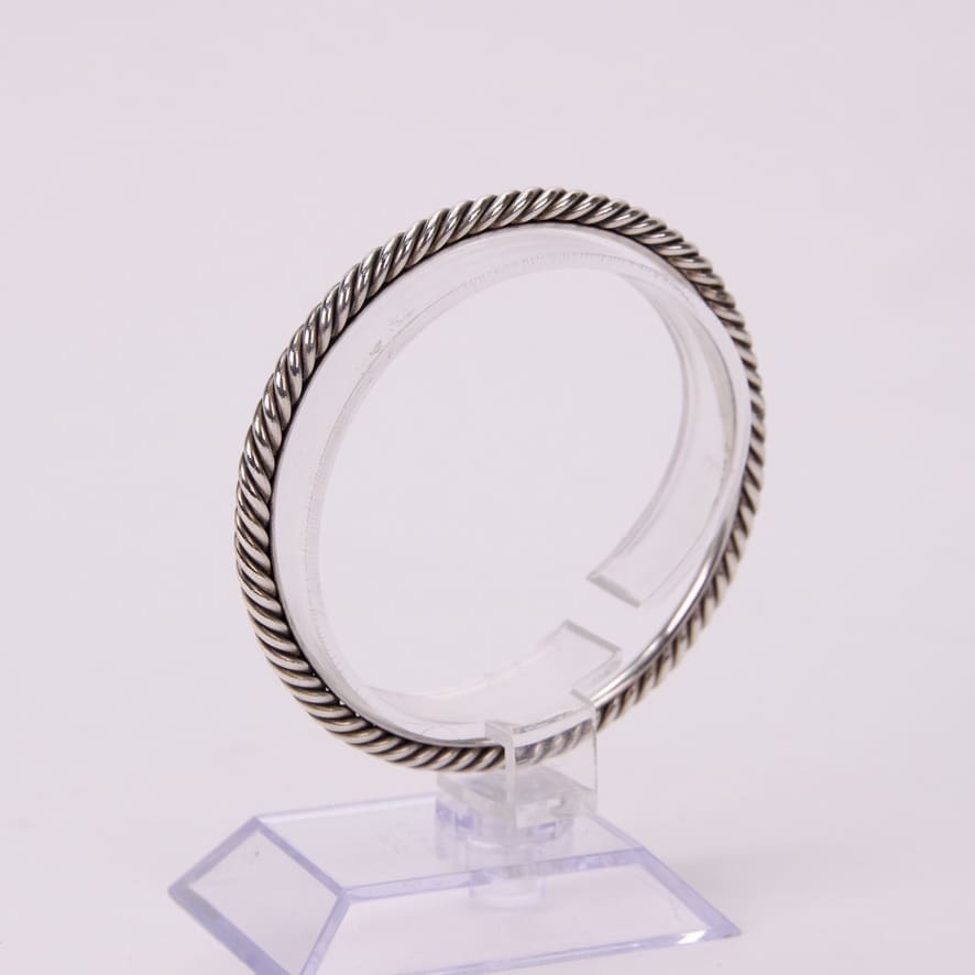 Silver twisted rope design bracelet display.