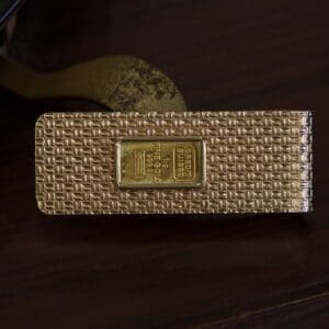 Gold bar design on textured surface.