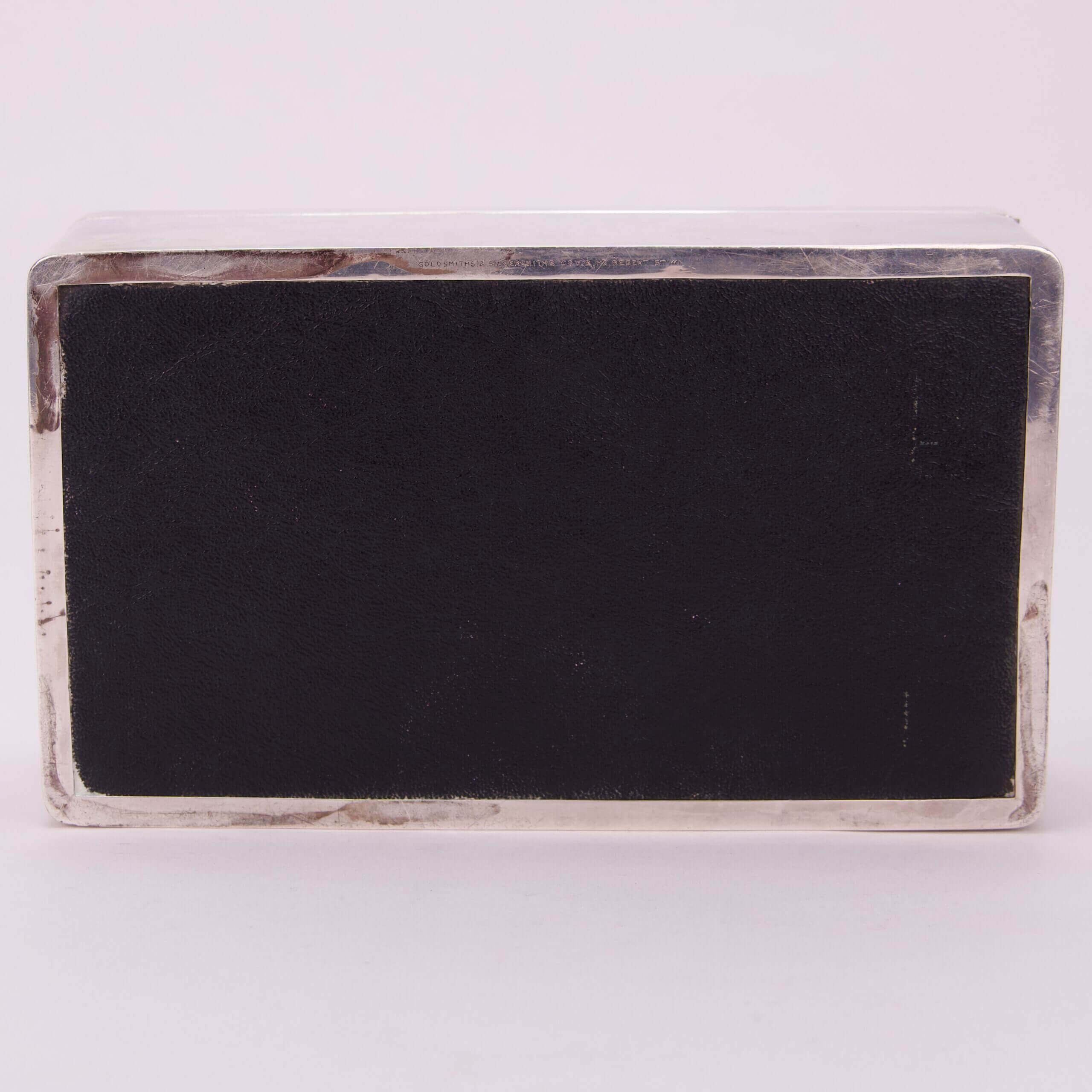 Rectangular metal box with black surface.
