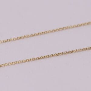 Gold chain on a light background.