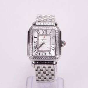 Silver square watch with Roman numerals.