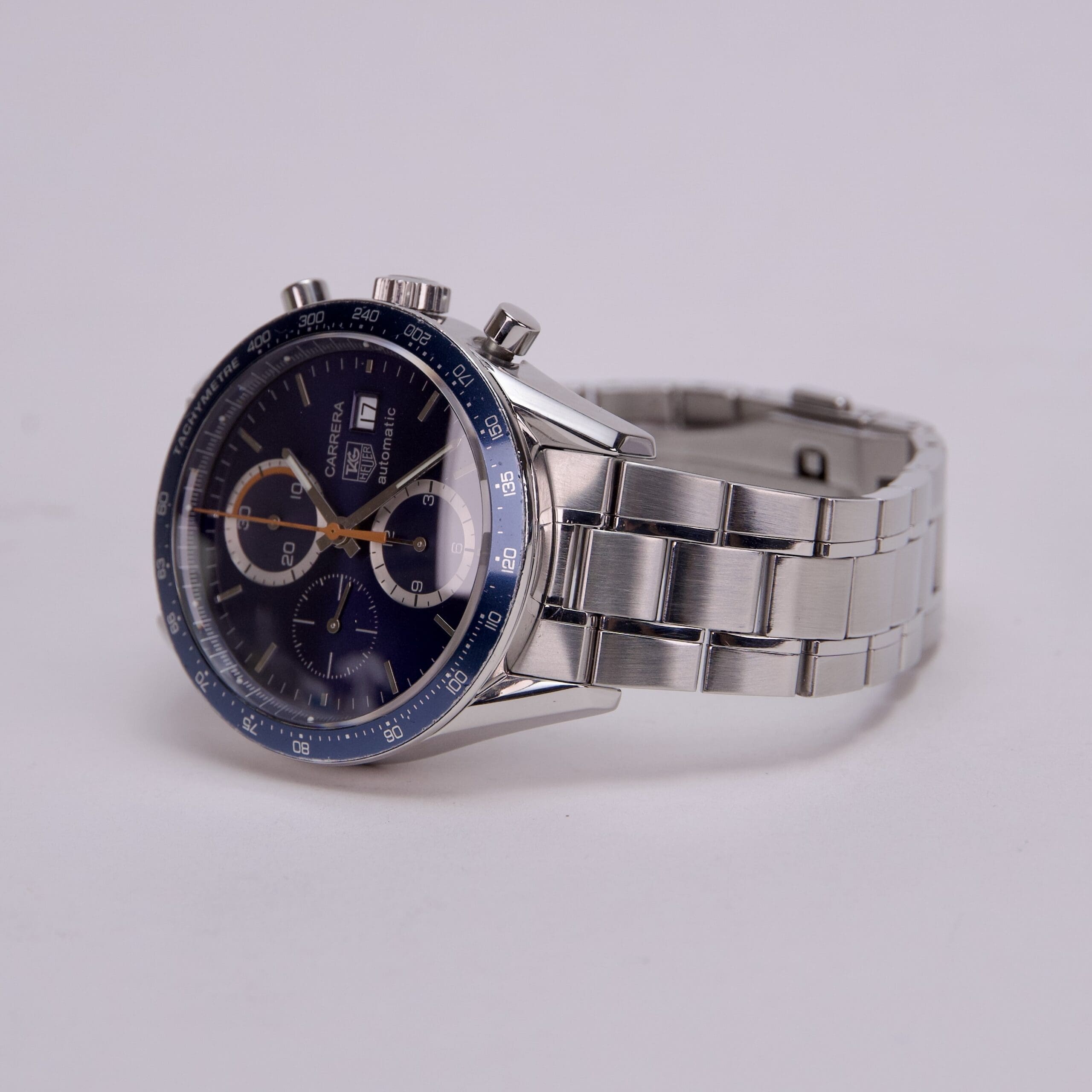 Silver chronograph watch with blue dial.