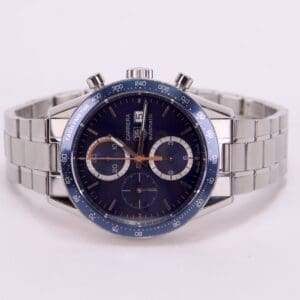 Luxury silver watch with blue dial.
