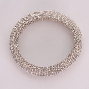 Silver woven chain bracelet on display.