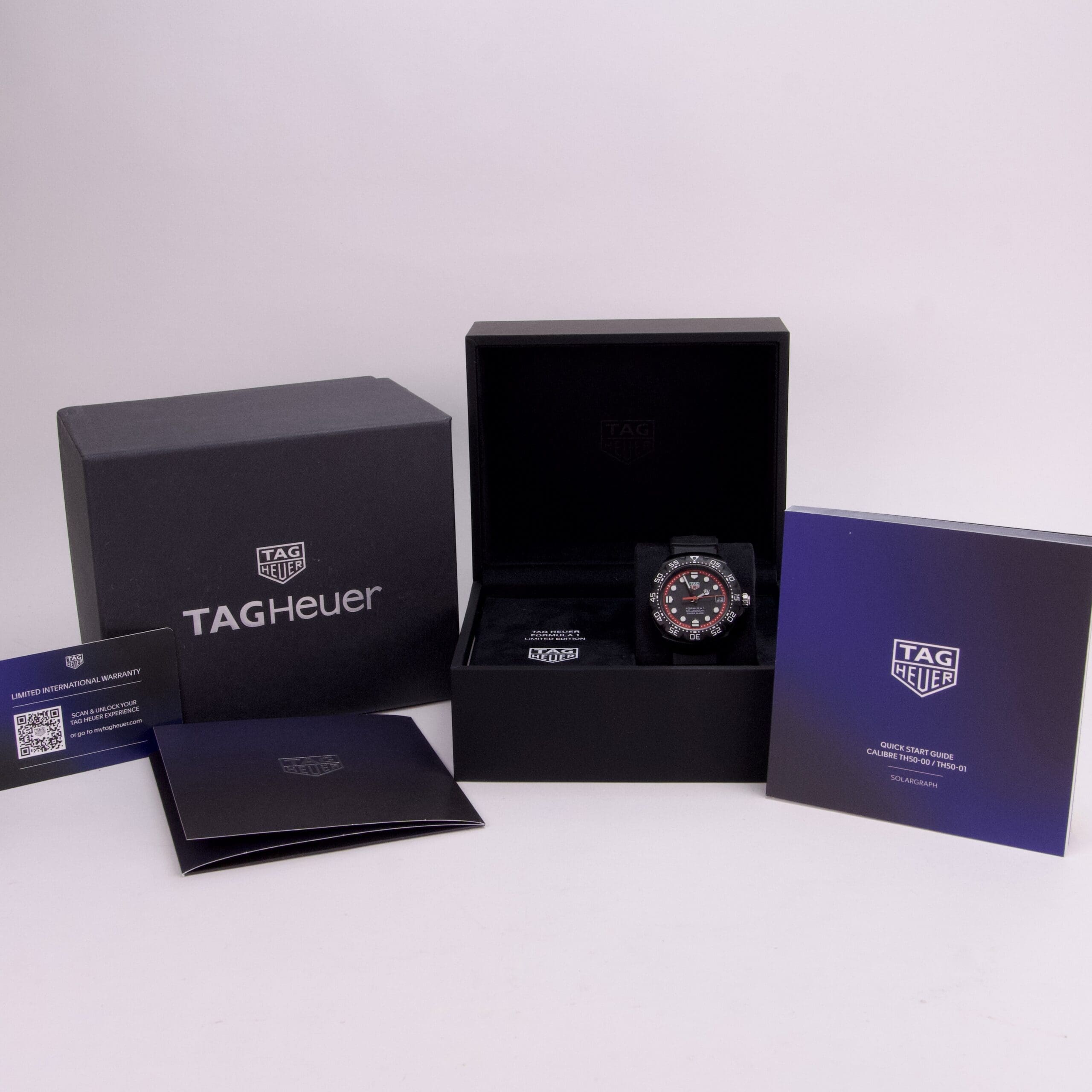 TAG Heuer watch with packaging and documents.