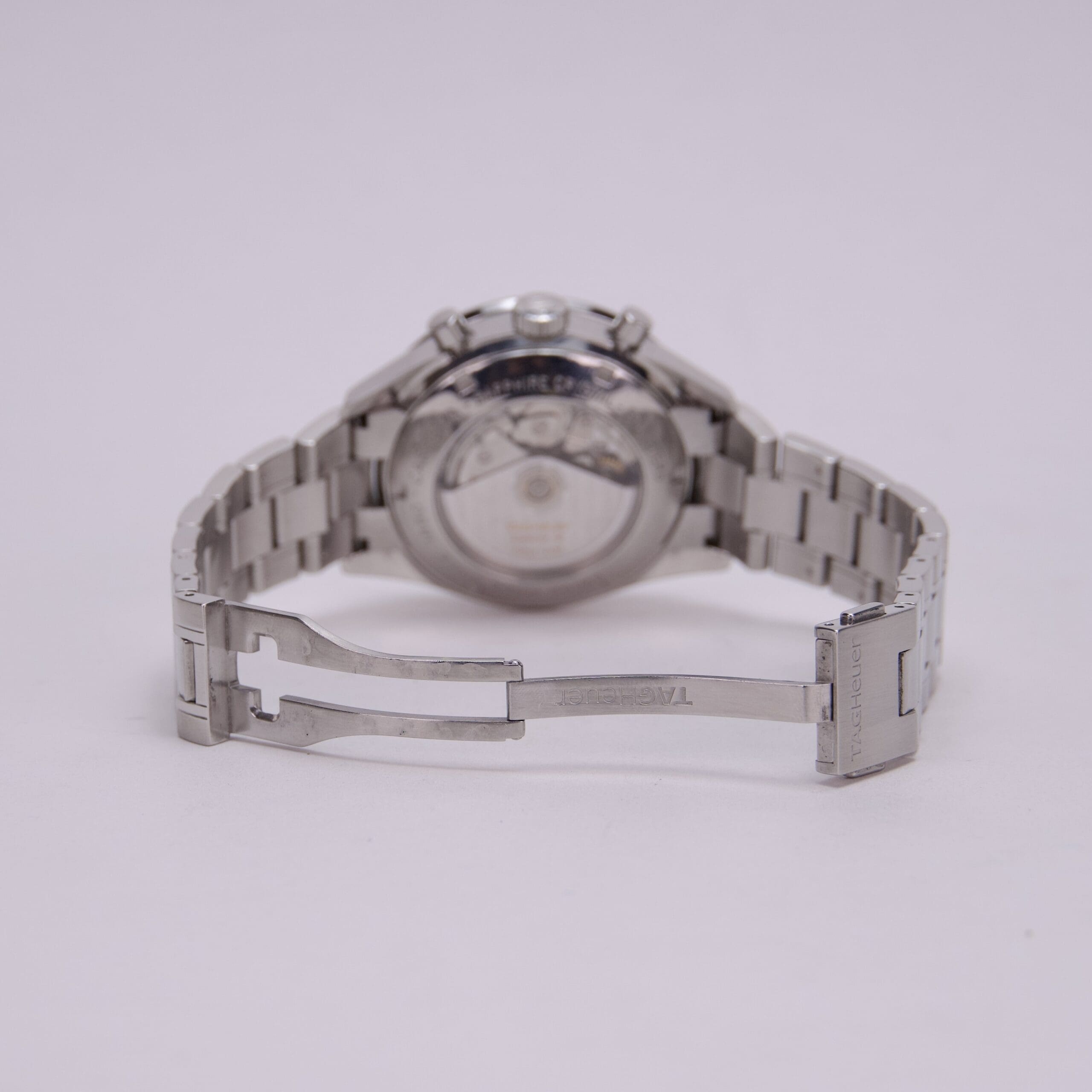 Silver watch with open metal band.