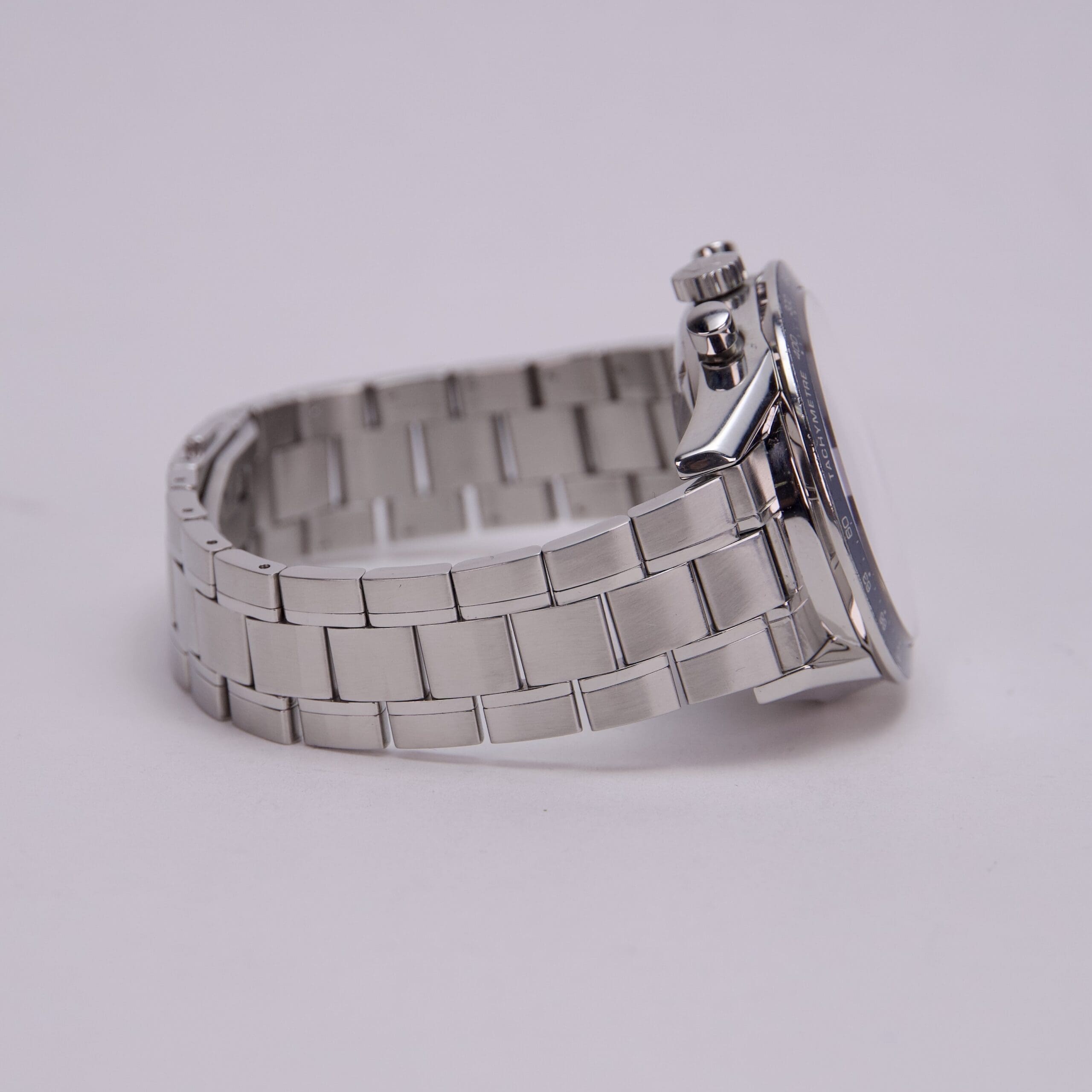 Silver wristwatch with metal band.