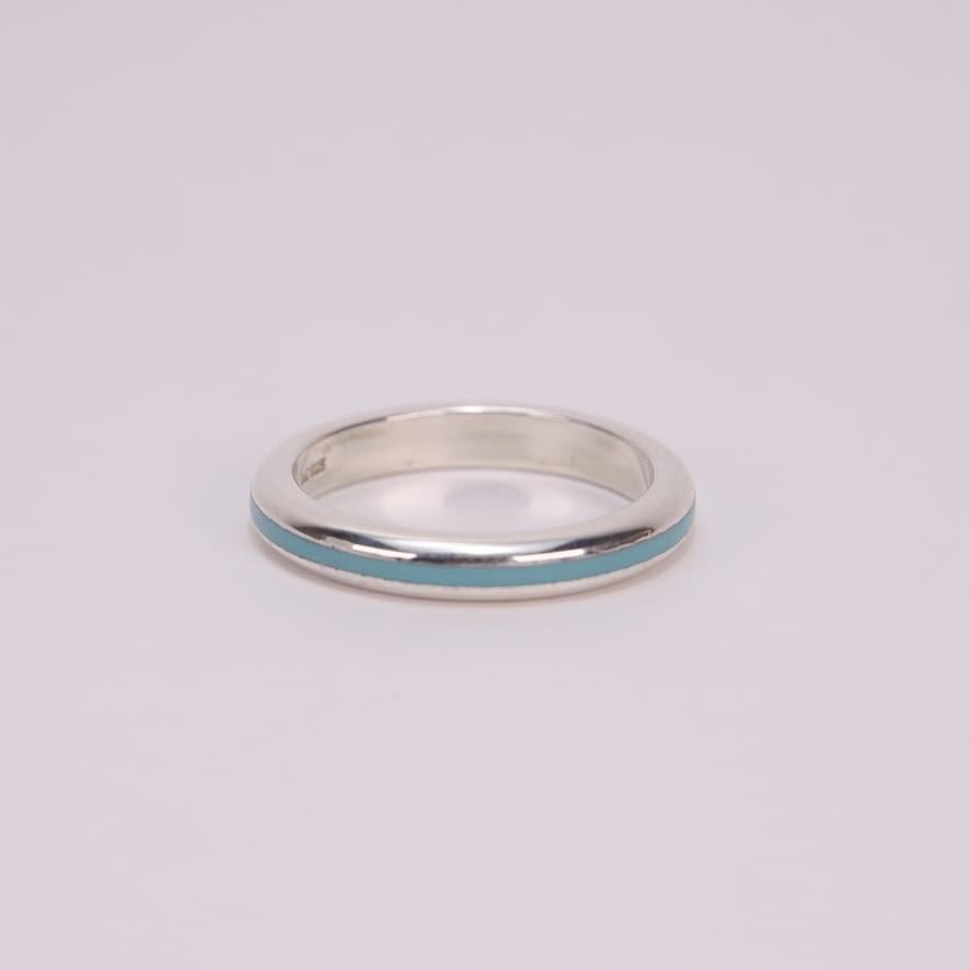 Silver ring with turquoise inlay.