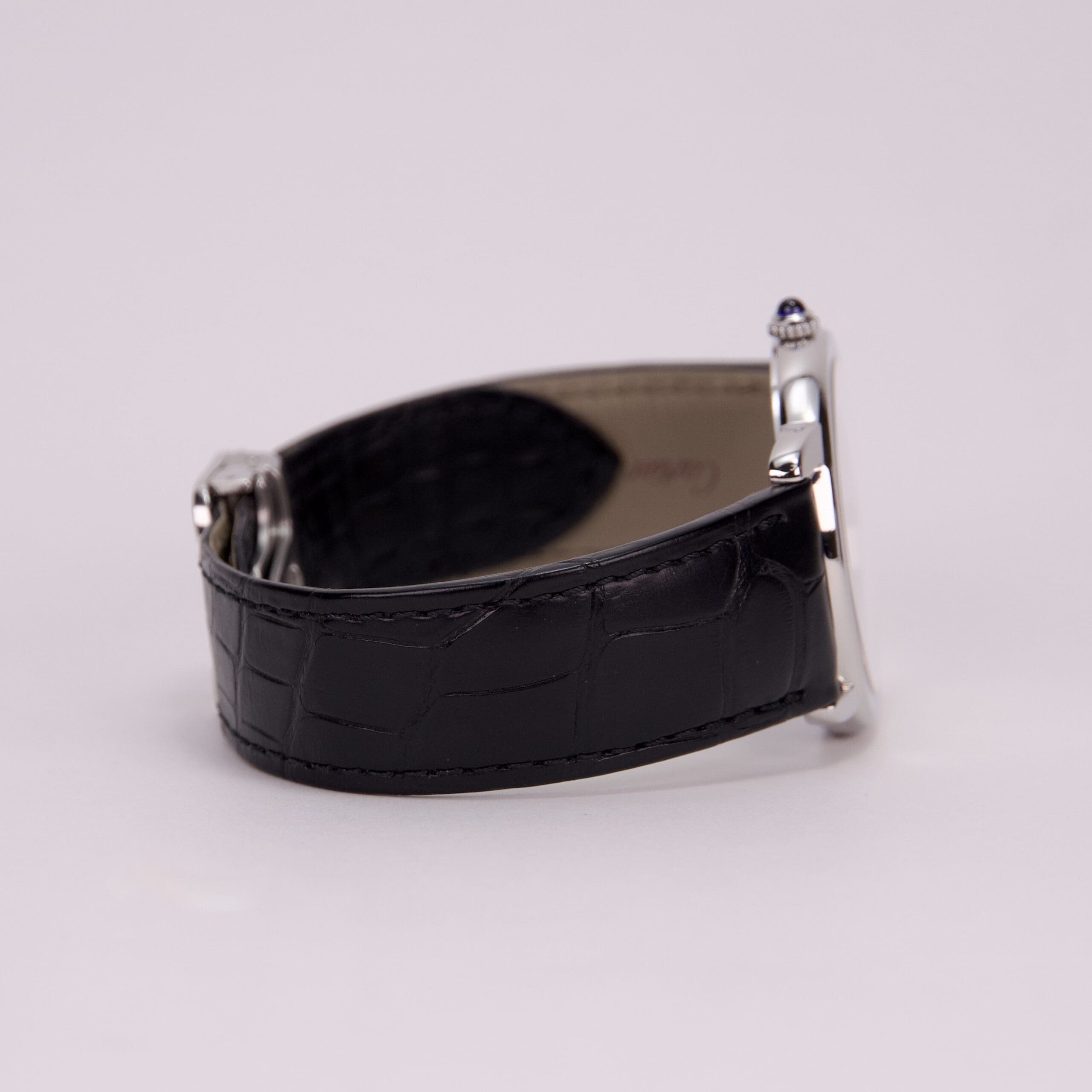 Black leather watch strap, side view.