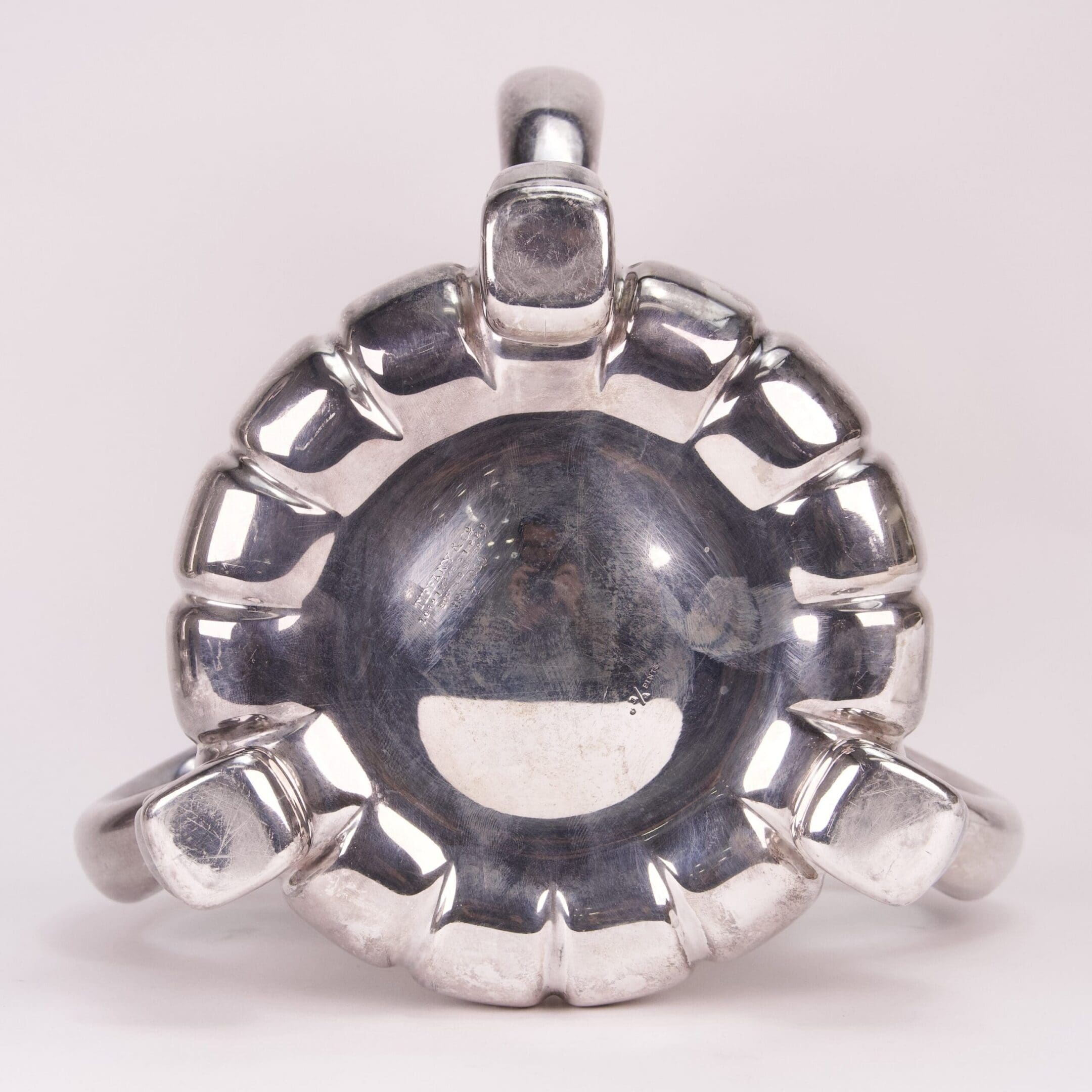 Silver ring with a circular, textured design.