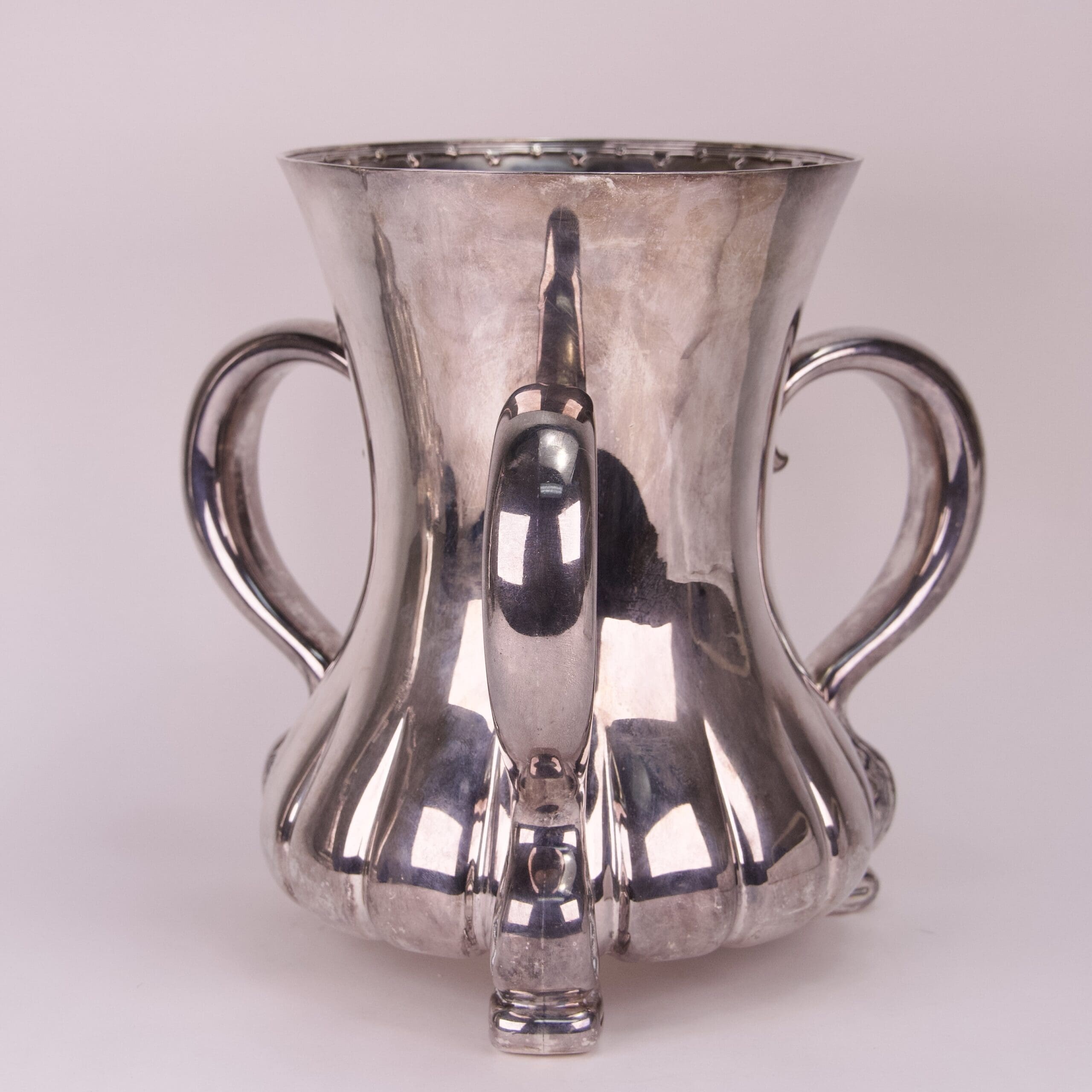 Silver vintage double-handled spouted vase.