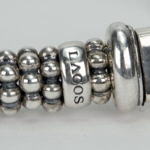 Silver beaded bracelet with "LAGOS" inscription.