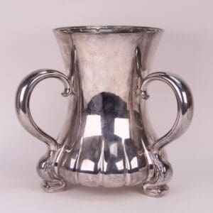 Silver decorative vase with ornate handles.