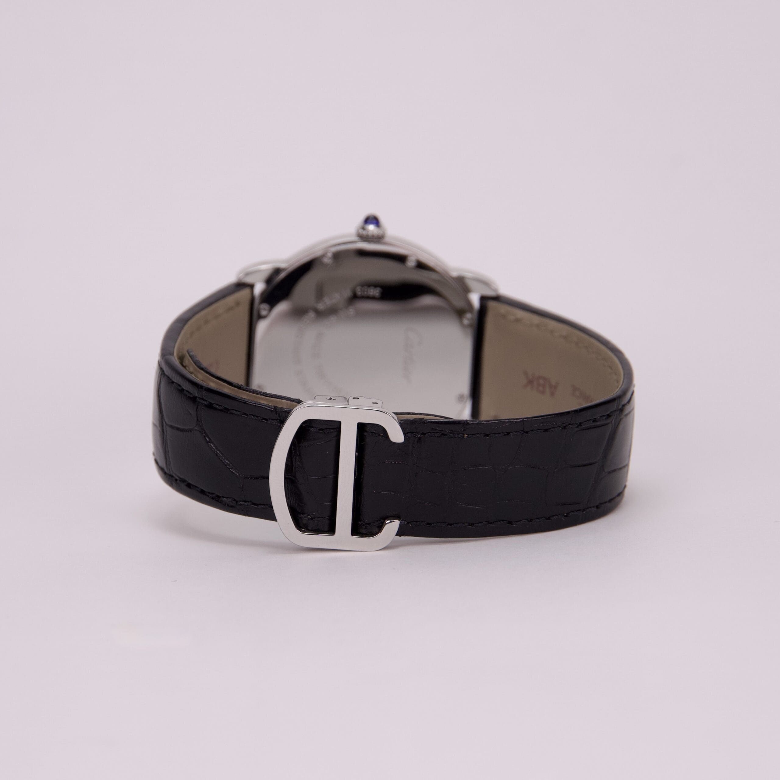 Black leather watch strap with silver buckle.