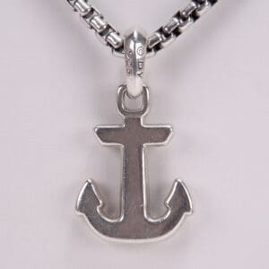 Anchor pendant on a chain necklace.