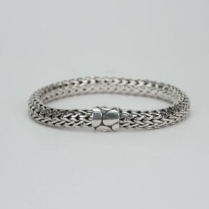 Silver woven bracelet with clasp.