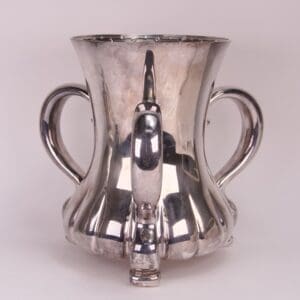Silver trophy cup with two handles.