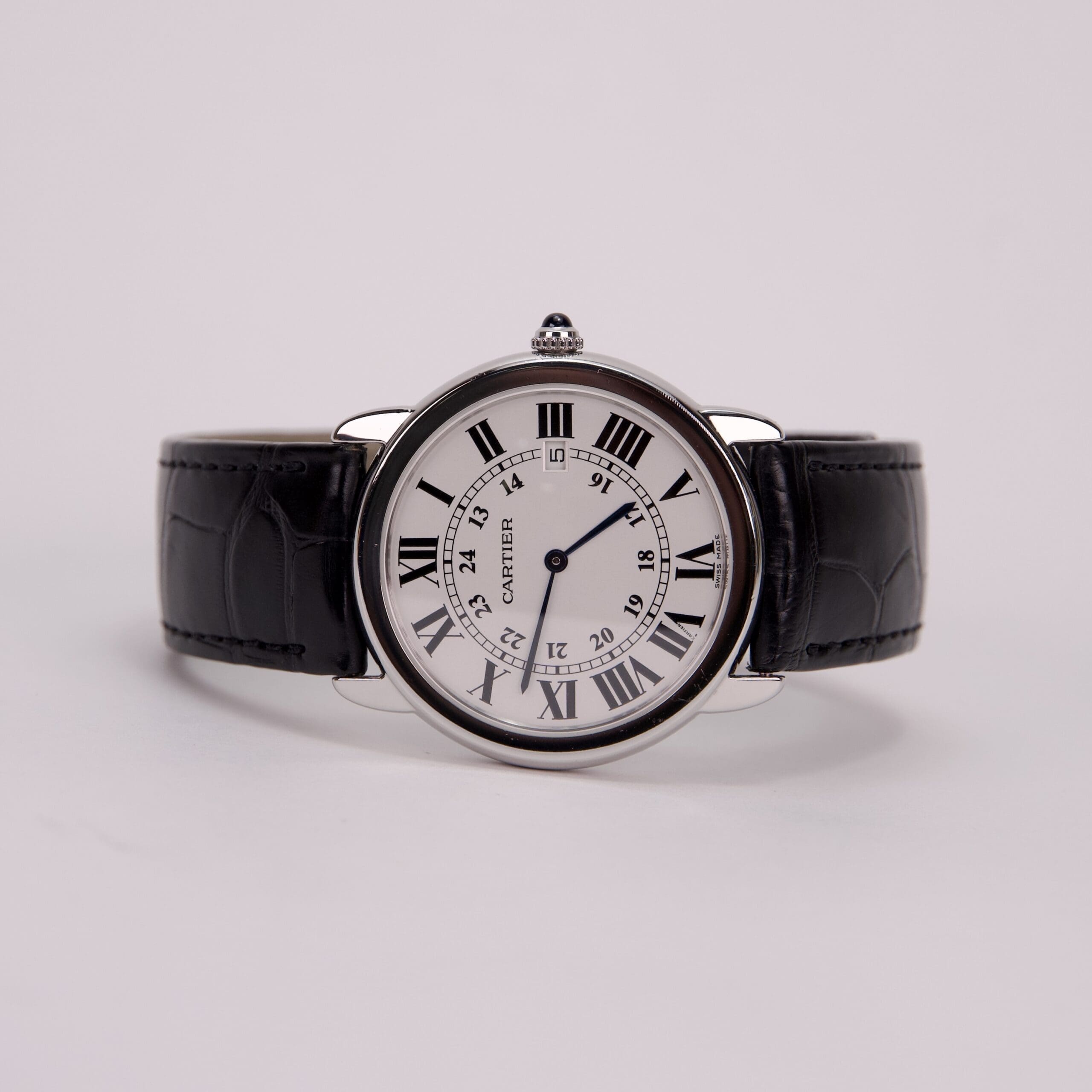 Luxury wristwatch with black leather strap.