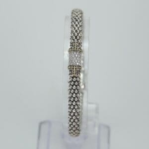 Elegant silver bracelet with decorative clasp.