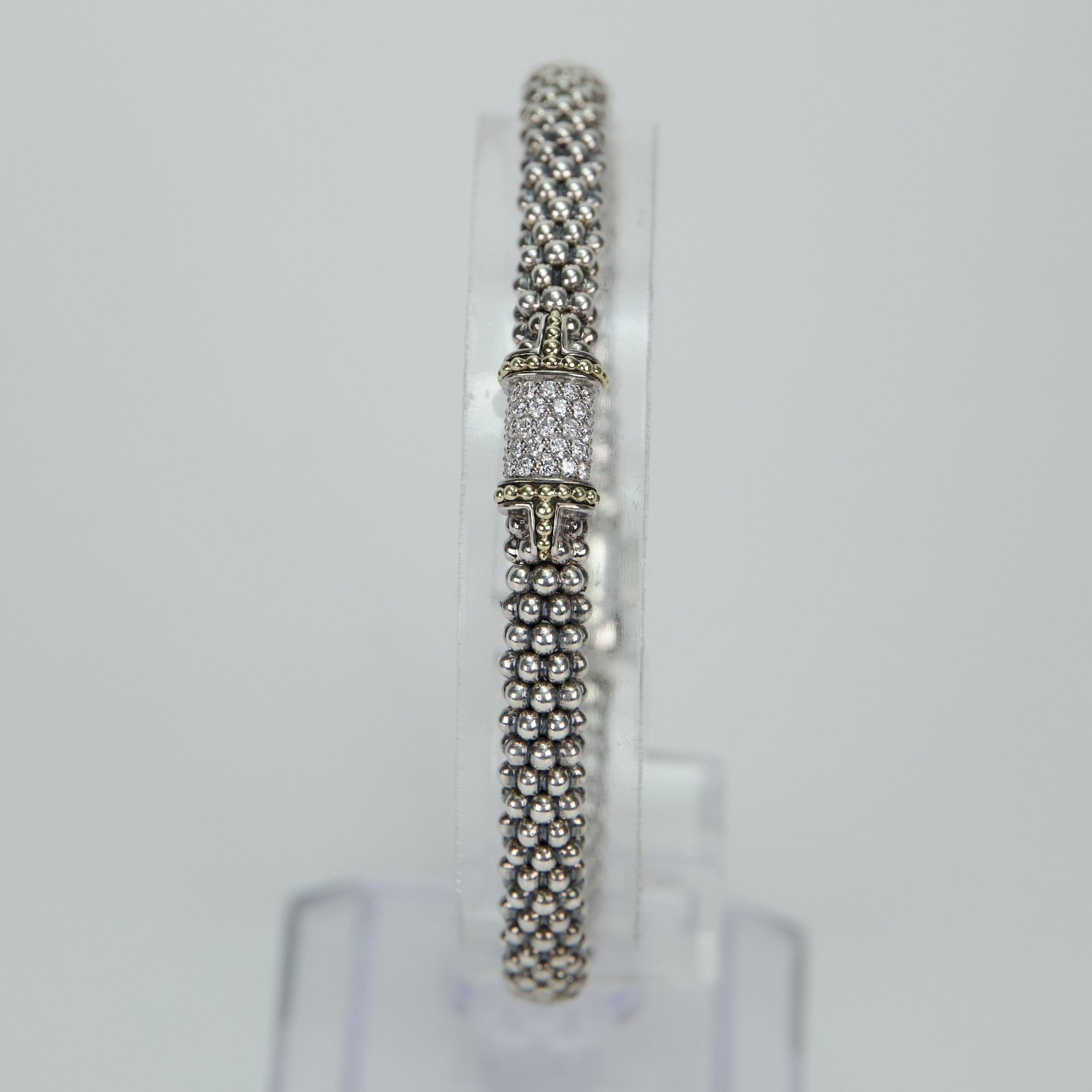 Elegant silver bracelet with decorative clasp.