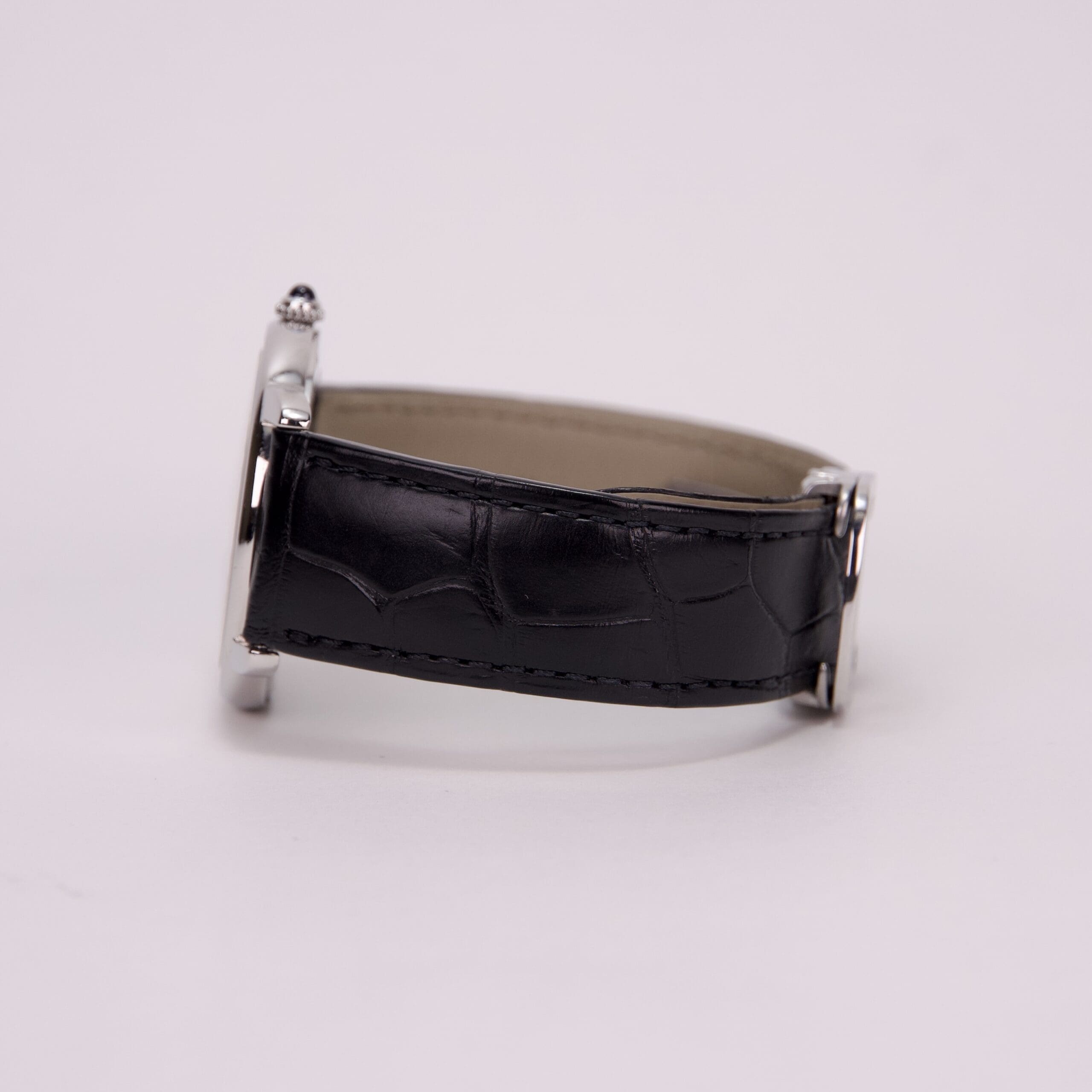 Black leather watch strap, side view.