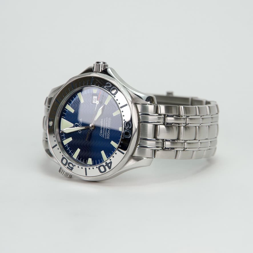 Silver wristwatch with blue dial.