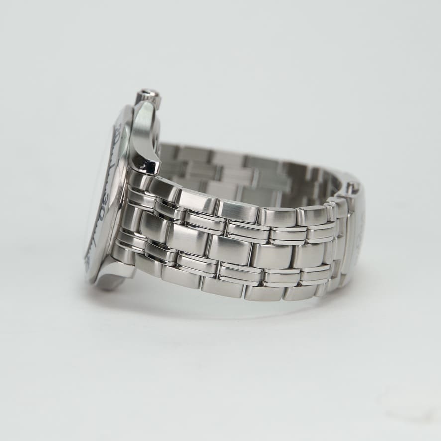 Silver metal wristwatch with linked band.